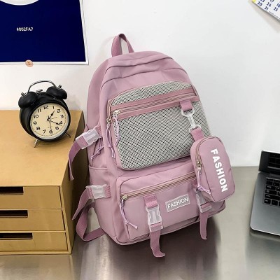 Ghiozdan tip Rucsac mov-lila din material textil impermeabil cu buzunare multiple si catarame ACRD377 Ghiozdan tip Rucsac mov-lila din material textil impermeabil cu buzunare multiple si catarame ACRD377